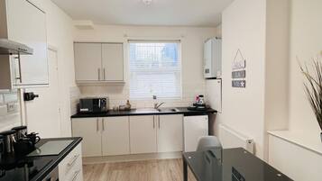 Deluxe appartement, en-suite badkamer | Gemeenschappelijke keuken