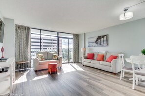 Condo, 2 Bedrooms, Balcony, Partial Ocean View (2651) | Living room | TV, DVD player - Sand Dunes Resort By Escape (Myrtle Beach)