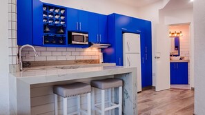 Fridge, microwave, stovetop, coffee/tea maker