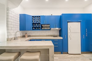 Fridge, microwave, stovetop, coffee/tea maker