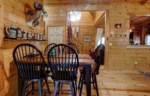 Enjoy meals and social gatherings in this inviting dining area with a long table and comfortable seating for six.