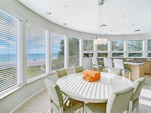Enjoy meals in this stylish dining area with a round table and comfortable chairs.