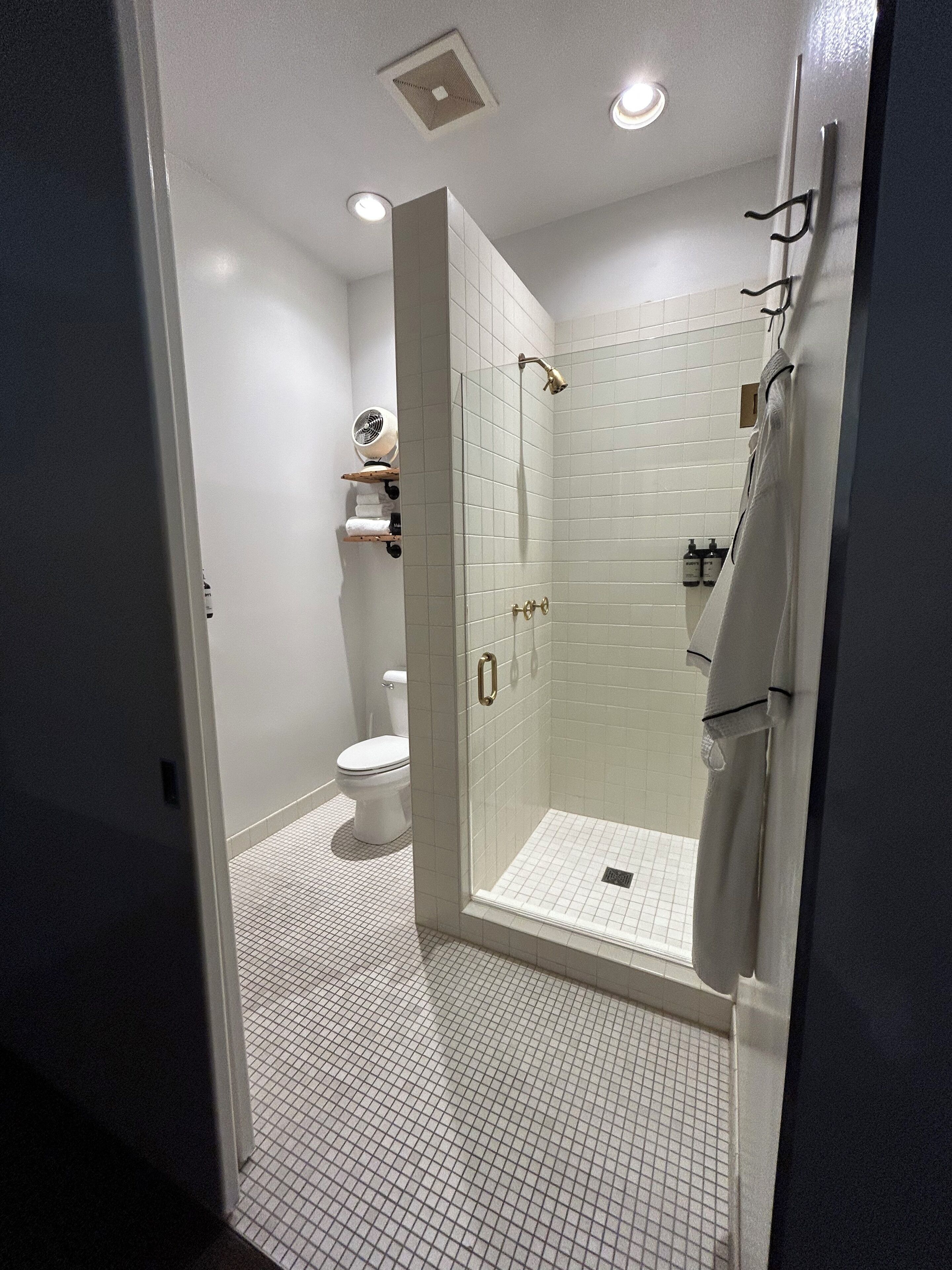 deluxe room with private bathroom | bathroom | shower, hair dryer, bathrobes, towels