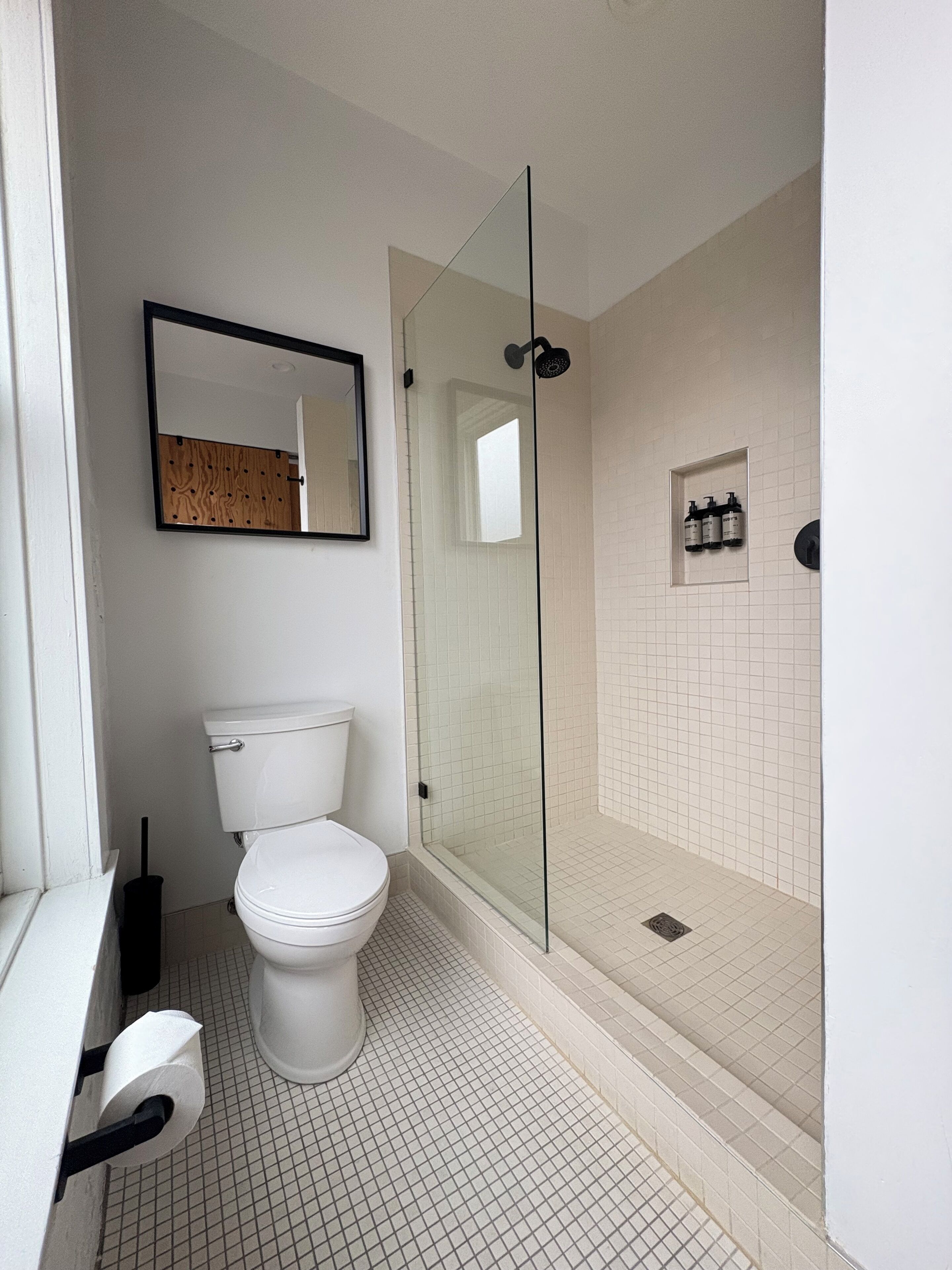 deluxe room with private bathroom | bathroom | shower, hair dryer, bathrobes, towels