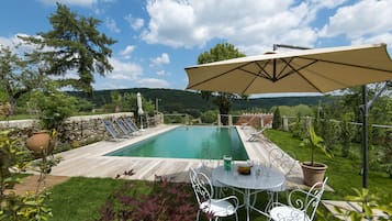 Outdoor pool, a heated pool, sun loungers