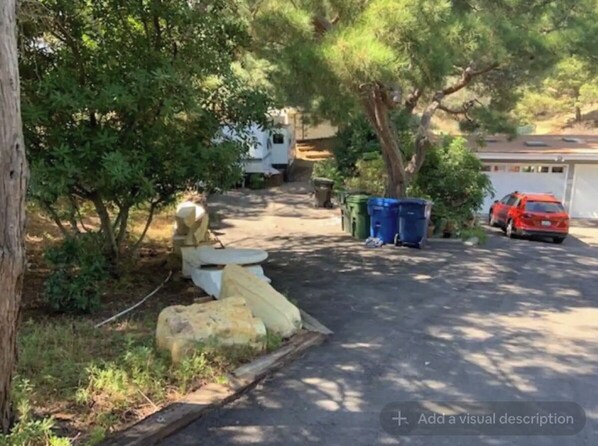 Property grounds - Cozy Mallard RV. Light, bright and inspiring trailer amongst the Pine trees. (Topanga)