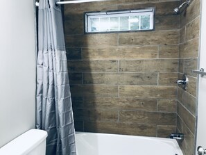 Combined shower/tub, hair dryer, towels, soap