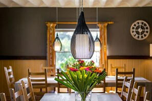 Enjoy meals with family and friends in this cozy dining area, complete with a table for four and comfortable seating.