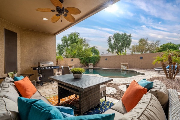 This home has it all! Plenty of outdoor seating and a sparkling HEATED swimming pool!