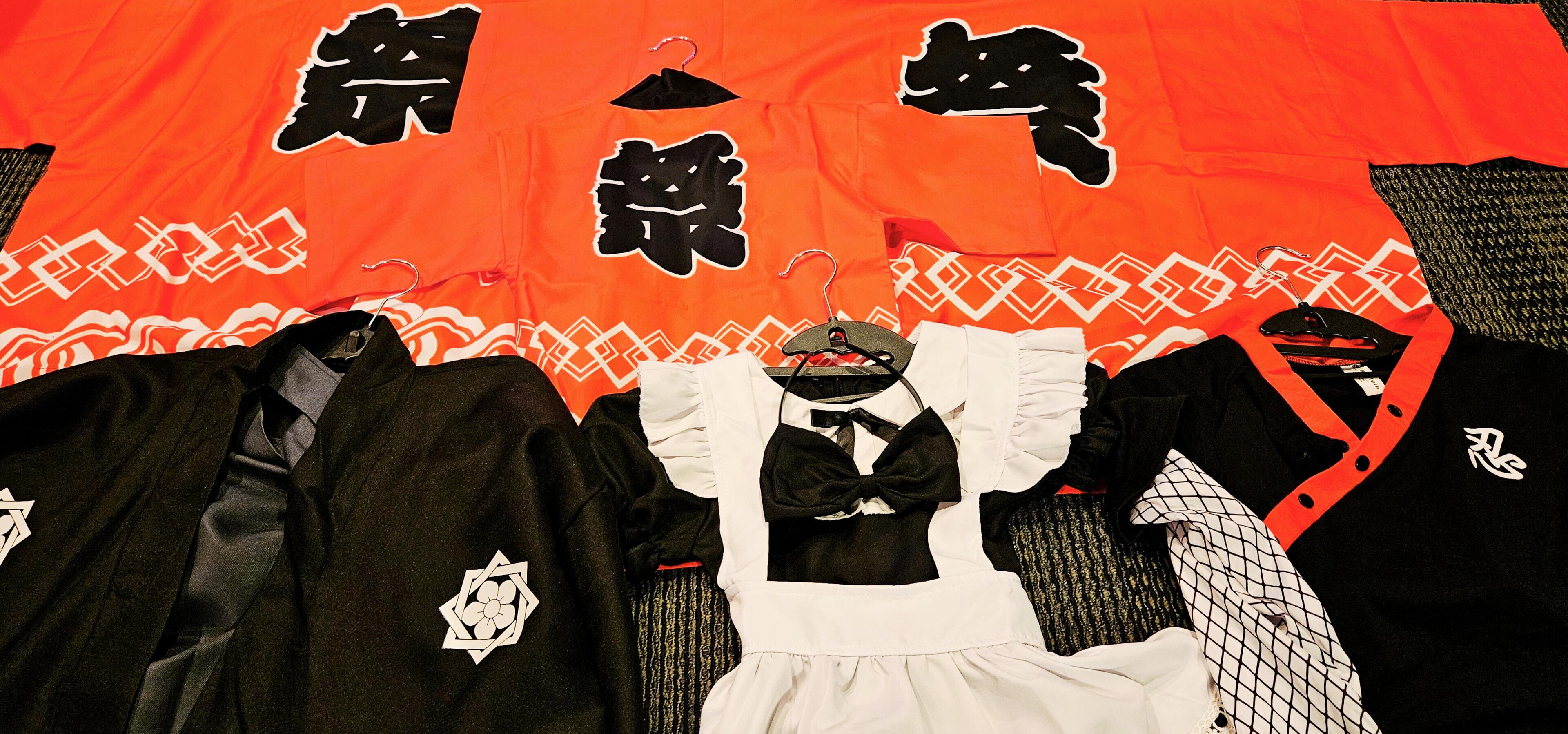 A traditional Japanese garment with a black and white pattern and a white collar.