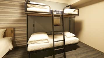 A bunk bed room with a wooden headboard, a ladder, and a carpeted floor.