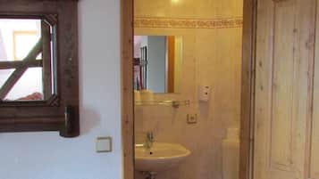 Shower, hair dryer, towels, toilet paper