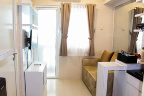 TV - Minimalist and Homey 2BR Aparment at Green Pramuka near Mall (Jakarta)