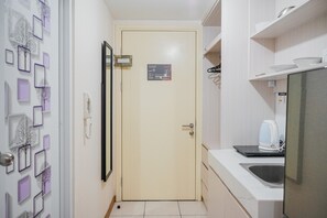 Fridge, stovetop, cookware/dishes/utensils - Minimalist Studio Apartment with City View at M-Town Residence (Gading Serpong)