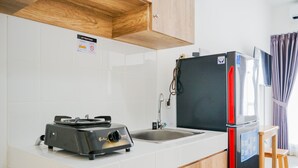 Room | Private kitchen | Fridge, stovetop, cookware/dishes/utensils - Lovely Studio Apartment at M-Town Residence near SMS Mall (Gading Serpong)