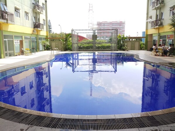 Outdoor pool - Chic 2BR The Suites @ Metro Apartment (Bandung)
