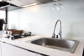 Private kitchen - Convenient Studio Apartment at Harvard Jatinangor (Cileunyi)