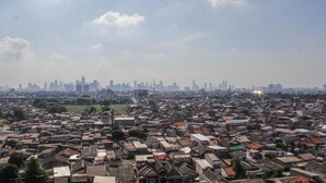 A densely packed urban area with numerous buildings and a distant city skyline. - Modern and Relax 2BR @ Bassura City Apartment (Jakarta)