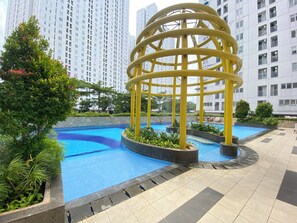 Outdoor pool - Relaxing 2BR Bassura City Apartment (Jakarta)