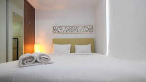Room | WiFi (free), bed sheets - Modern Style Studio Apartment at Azalea Suites with City View (Cikarang)