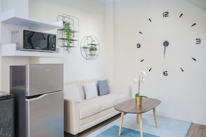 Quarto | Área de estar | TV
