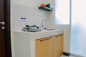 Room | Private kitchenette | Fridge, stovetop, cookware/dishes/utensils - Minimalist and Cozy 2BR Apartment at Casablanca East Residence (Jakarta)