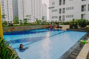 Outdoor pool - 2BR Fully Furnished Minimalist Bassura City Apartment (Jakarta)