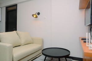 Habitación | Área de sala de estar | Televisión 