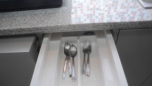 A drawer with spoons and forks. - Comfortable and Clean 2BR Green Pramuka Apartment (Jakarta)