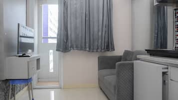 Quarto | Área de estar | TV