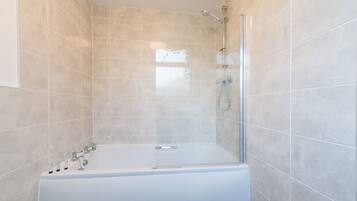 Combined shower/bathtub, hair dryer, towels, soap