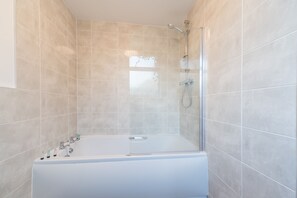 Combined shower/tub, hair dryer, towels, soap