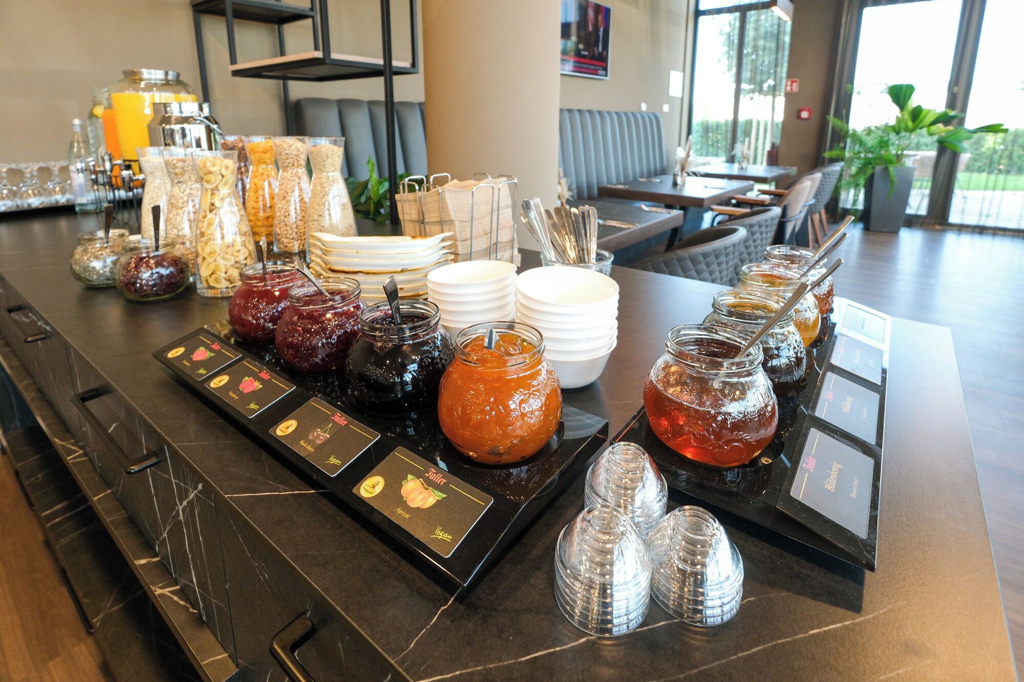 A breakfast buffet with various food options and condiments.