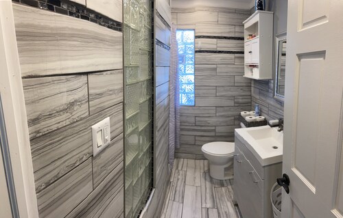 Luxury Cali King Suite · Smart TVs & Wireless Charging in Every Room