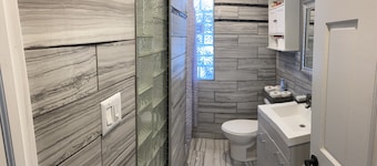 Luxury Cali King Suite · Smart TVs & Wireless Charging in Every Room