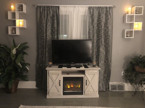 Luxury Cali King Suite · Smart TVs & Wireless Charging in Every Room