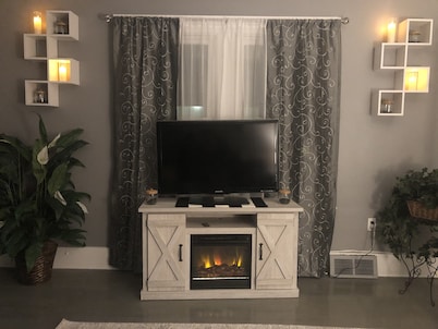 Luxury Cali King Suite · Smart TVs & Wireless Charging in Every Room