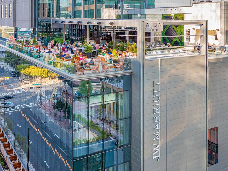 A JW Marriott hotel with a rooftop bar and outdoor seating area.