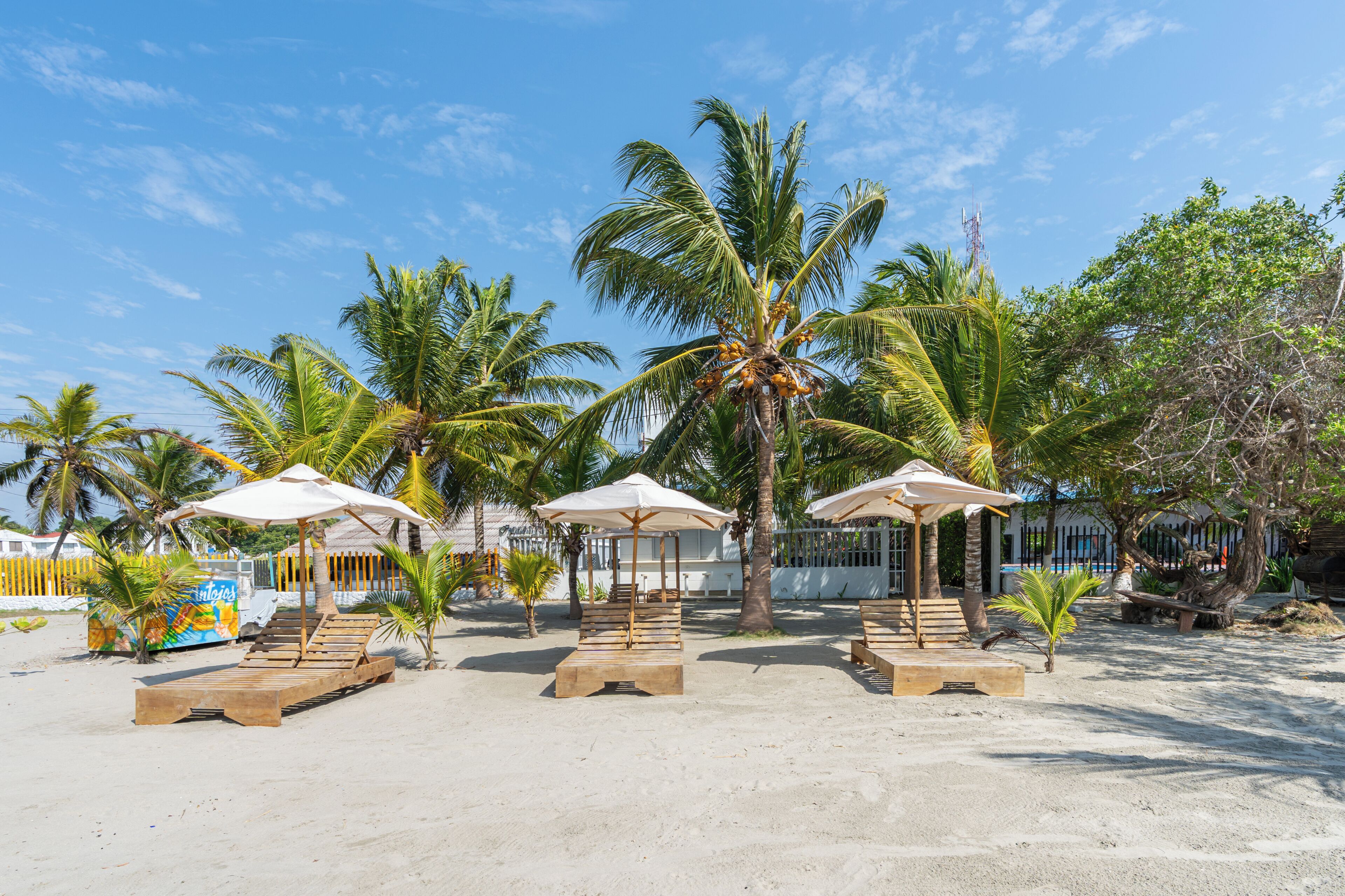 On the beach, white sand, beach towels, beach volleyball