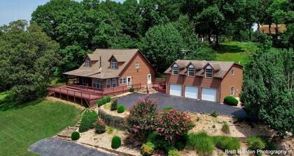 Beautiful Home on 18 acres with view of Beaver Lake and lake access.