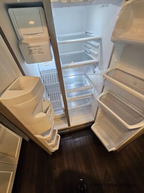 Kitchen essentials at your fingertips, this refrigerator offers ample storage space for all your food and drinks.