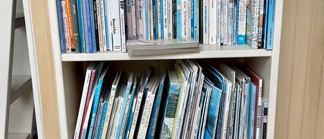 A bookshelf with multiple shelves filled with books.