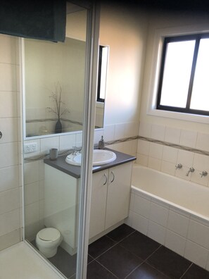 Bathtub, hair dryer, towels, soap