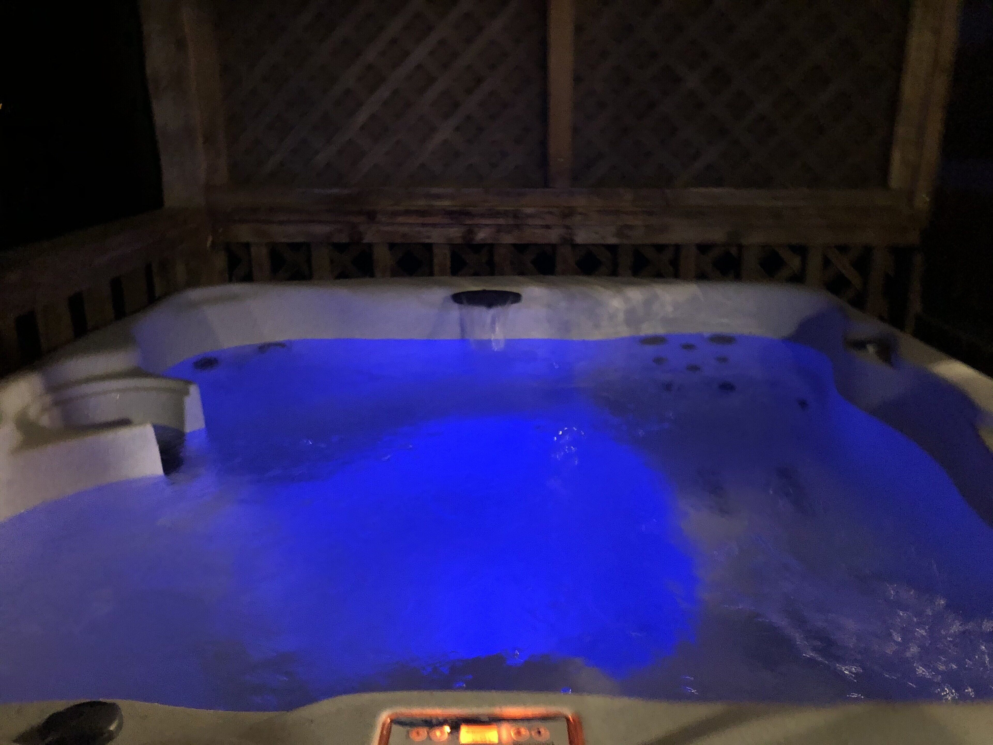 A hot tub with a blue light.