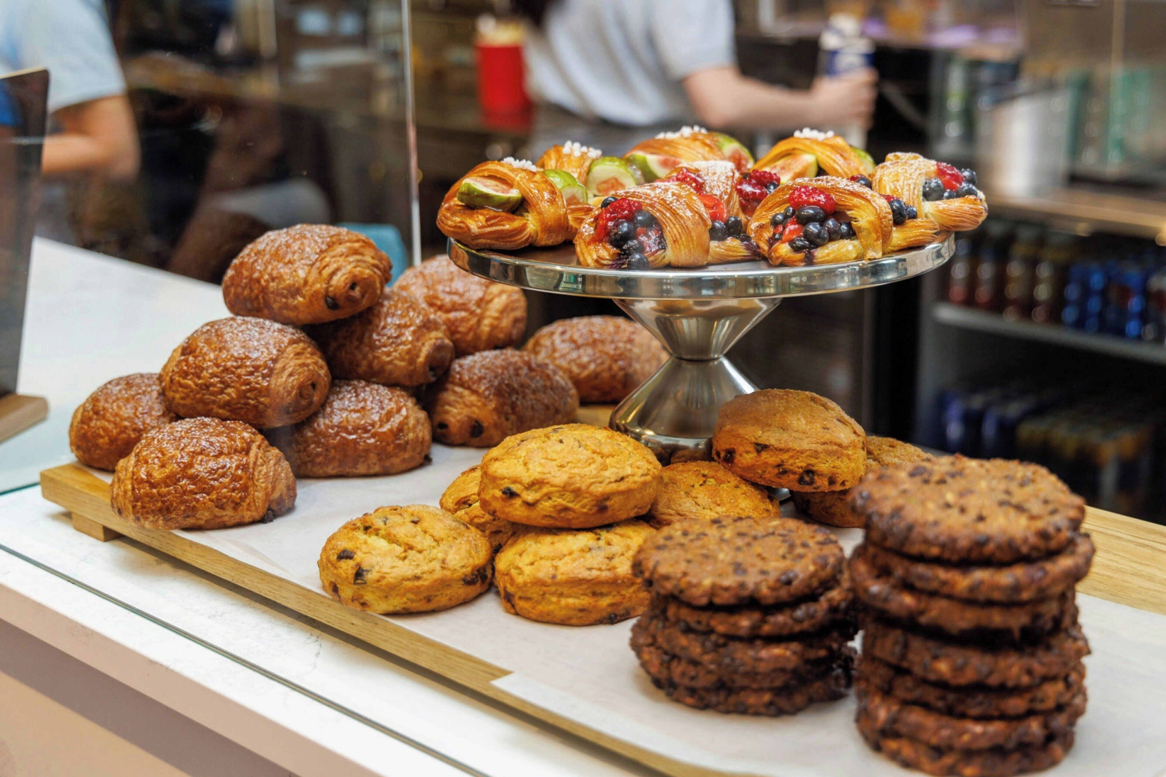A display of assorted pastries and cookies on a counter.