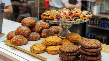 A display of assorted pastries and cookies on a counter.