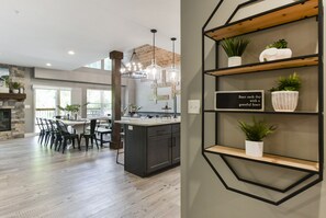Enjoy meals in the kitchen and dining area with a central island, fireplace, and ample natural light.