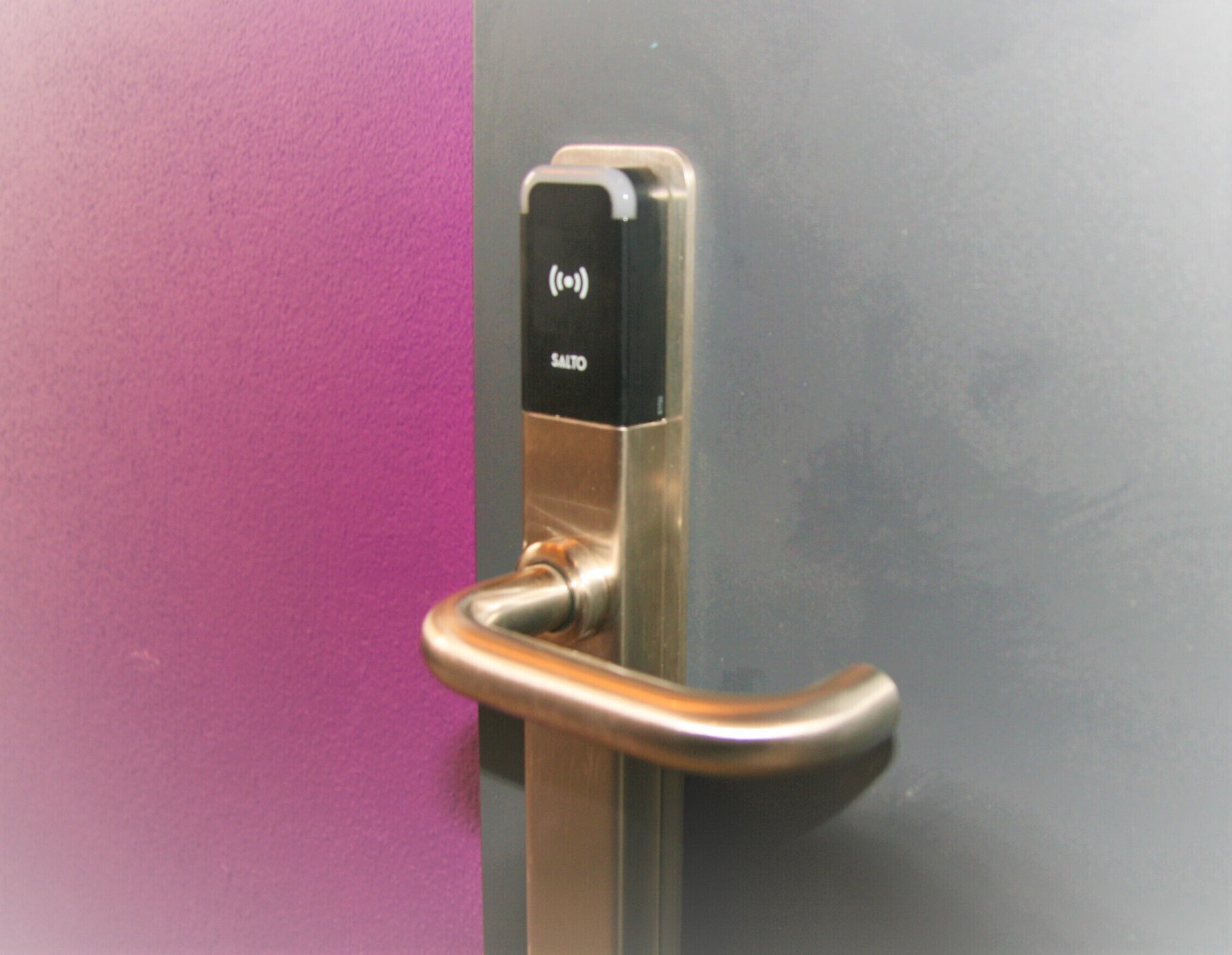 A door handle with a keycard reader.