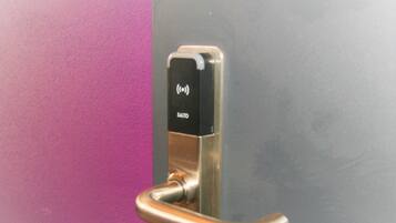 A door handle with a keycard reader.