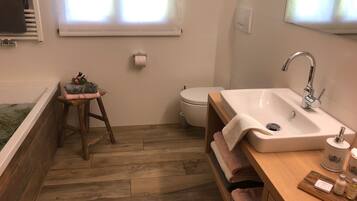 Bathtub, hair dryer, towels